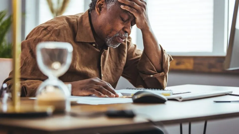 Concerned Senior Man Thinking at Desk_What Causes Memory Loss
